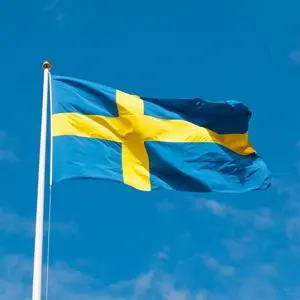 The Swedish flag blowing in the wind