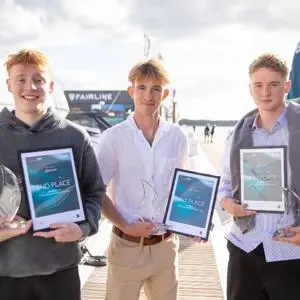 James pictured with the two other winners holding their certificate