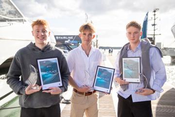 James pictured with the two other winners holding their certificate