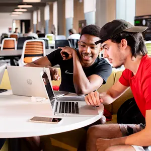 Two students looking at a computer screen