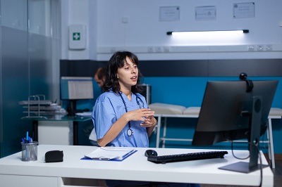 Healthcare worker having a conversation via video screen