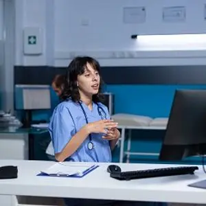 Healthcare worker having a conversation via video screen