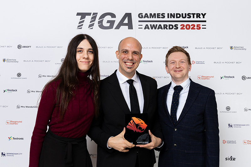 Dr Jennifer Challenor, Professor Chris Headleand and Dr Kieran Hicks with the TIGA trophy