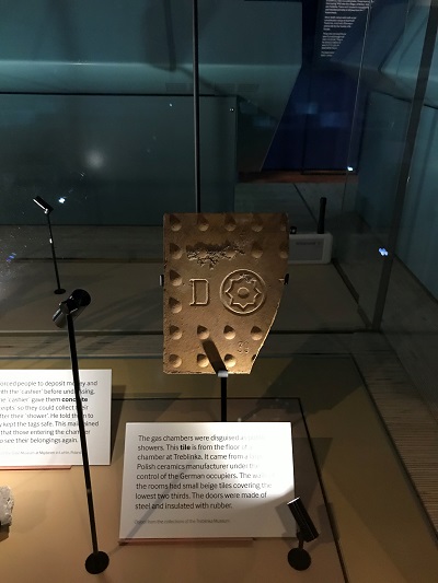 The Treblinka gas chamber tile in a display cabinet 