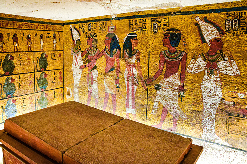 The inside of Tutankhamun's tomb with paintings of people on the walls