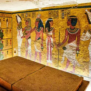 The inside of Tutankhamun's tomb with paintings of people on the walls