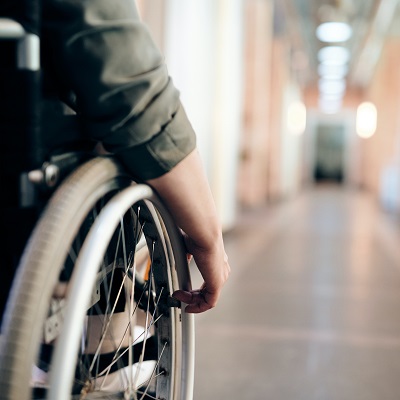 Close up of the hand of wheelchair user