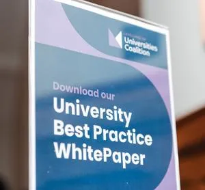 Sign which invites people to download the report