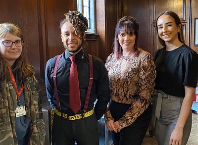 Image of the four prize winning students on the day that they collected their prizes from Staffordshire County Council standing proudly together and smiling.