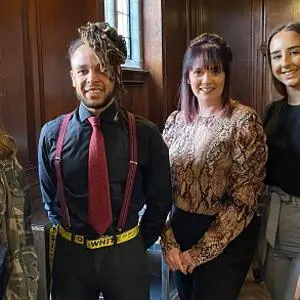 Image of the four prize winning students on the day that they collected their prizes from Staffordshire County Council standing proudly together and smiling.