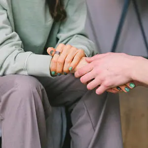 Women holding hands