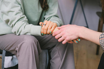 Women holding hands