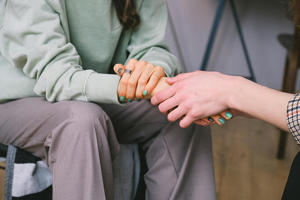 Women holding hands