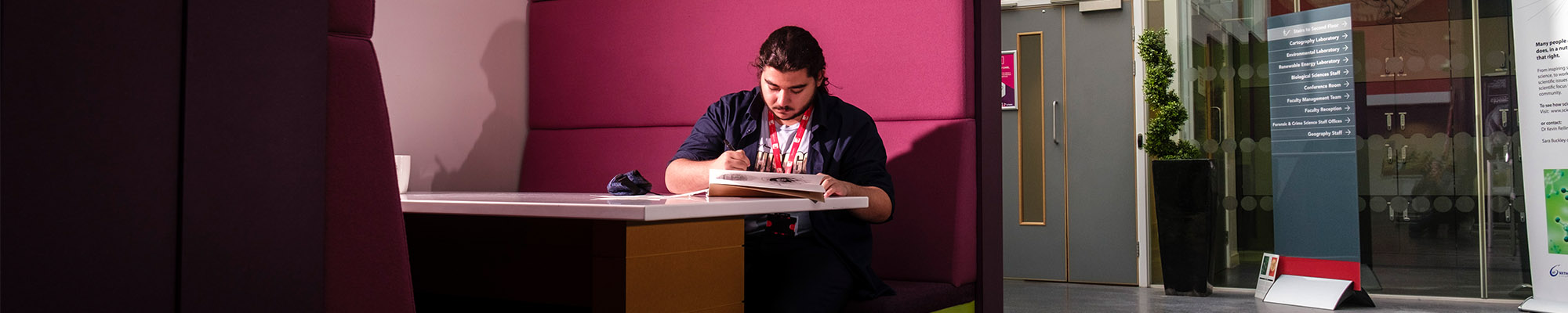 male postgraduate student working alone in the science centre