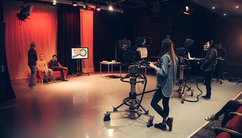 Students practising their camera work in the TV Studio