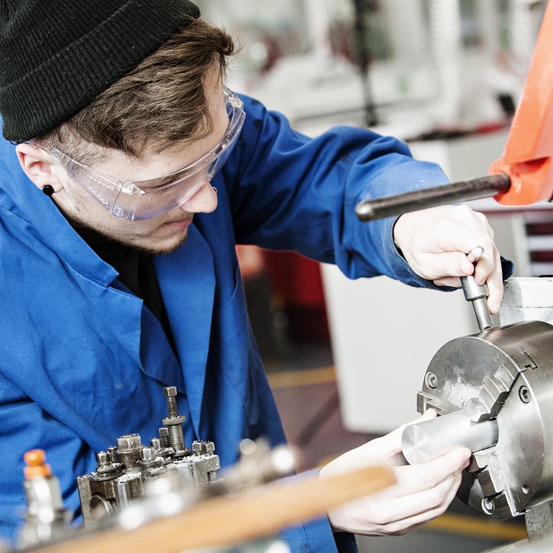 A male mechanical engineering students working in a lab