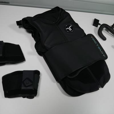 The Tactot Haptic Vest, Tactal haptic face cushion, and Tactosy pair of haptic sleeves