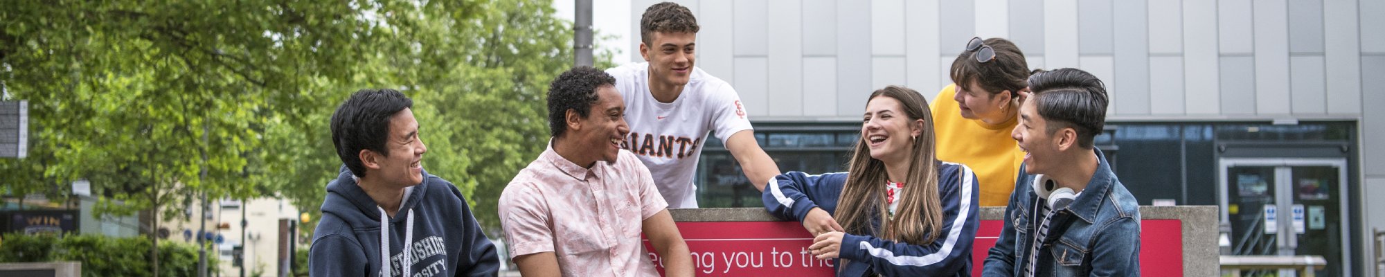 A group of smiling international students at Staffordshire University