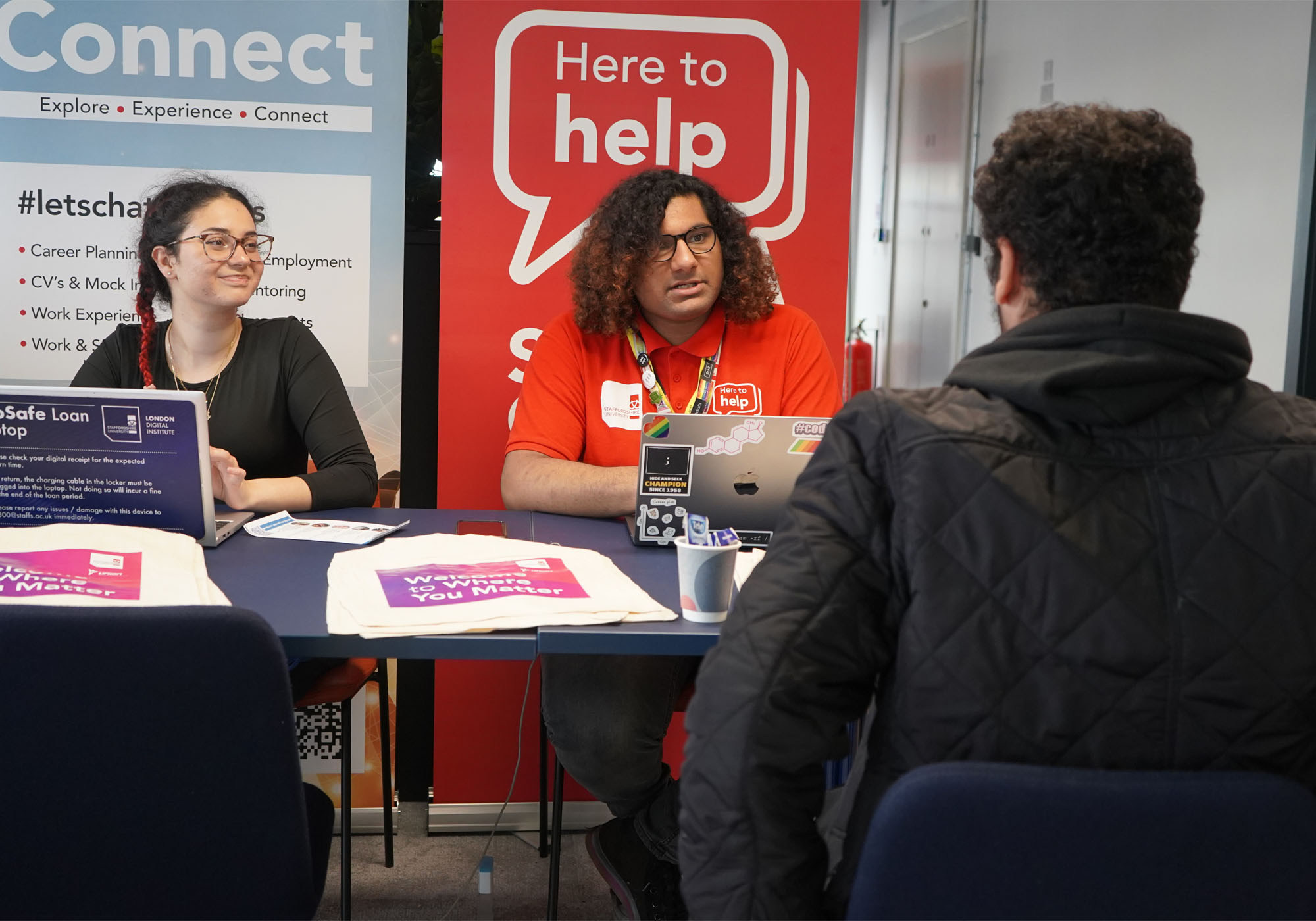 A student is chatting to support staff
