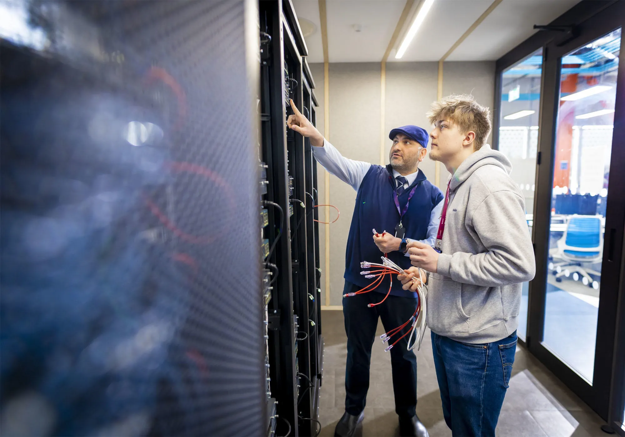 A student and lecturer are in the networking lab cabling kit