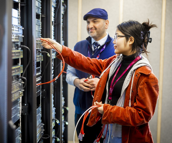 Students are cabling in the networking lab