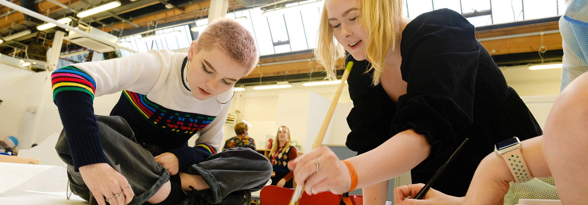 art students working on a group project in the henrion studios