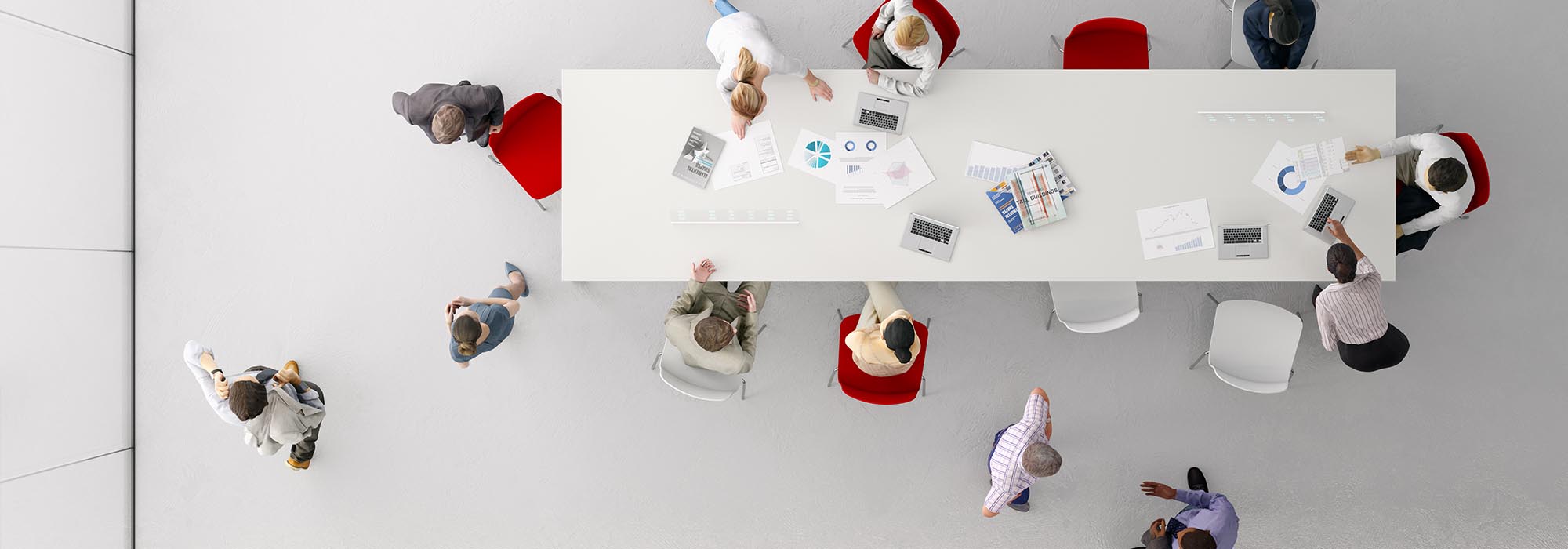 group of employees around a desk