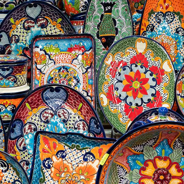 multi-coloured ceramic plates and bowls