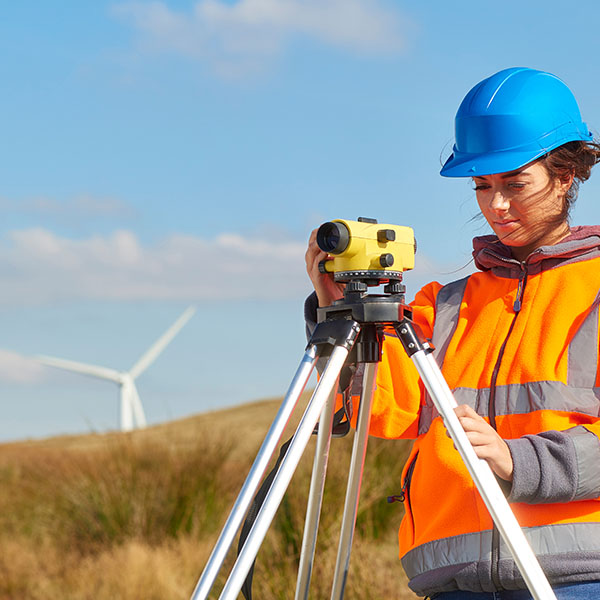 female environmental engineer works on wind farm