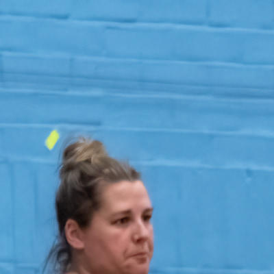 Wing attacker looks for a open teammate as she is covered by defence