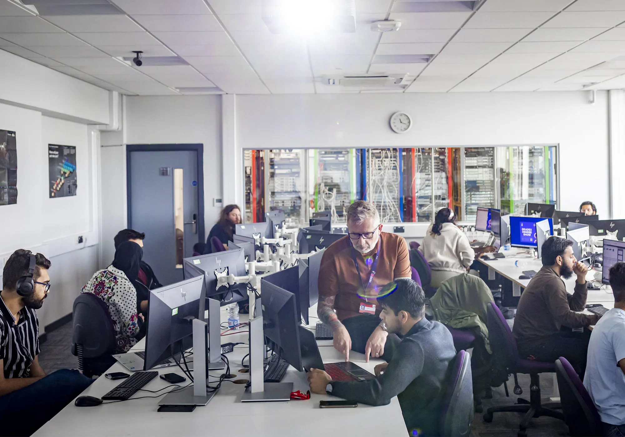 Students are in the networking lab using computers