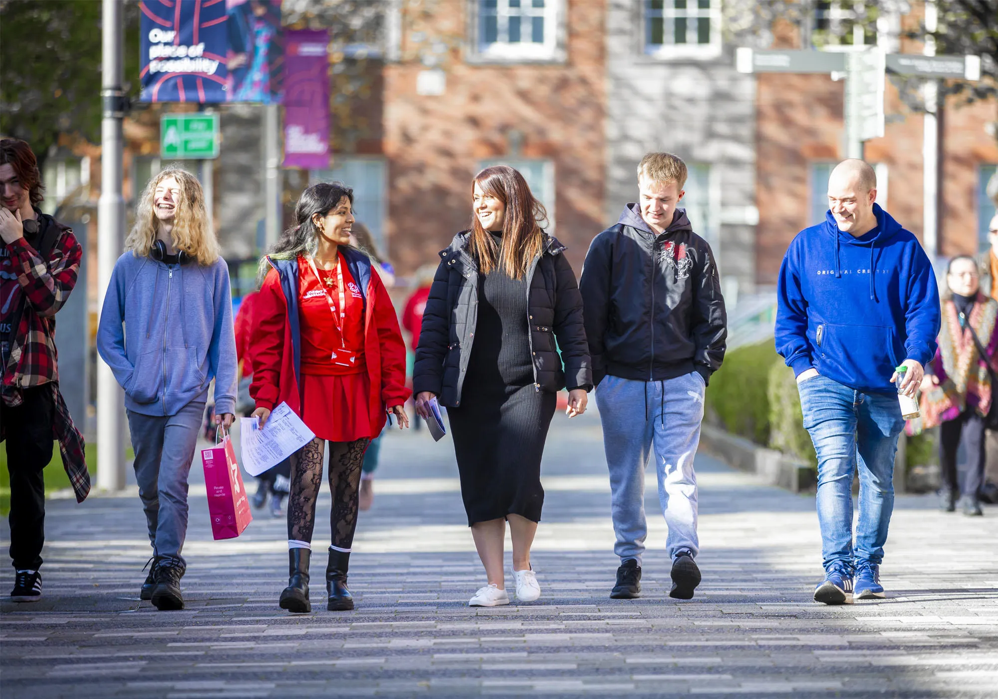 A group of open day visitors are being guided around campus
