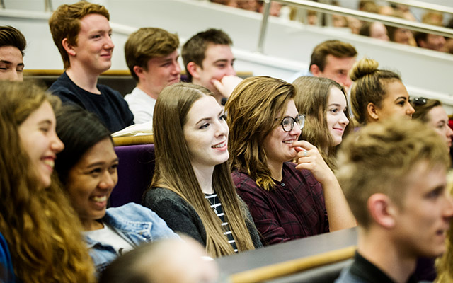 students listening to a welcome talk