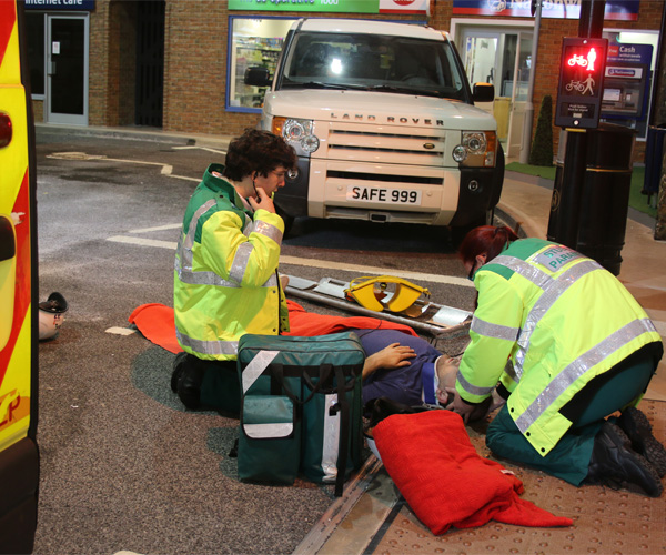 Student paramedics are acting out an accident simulation